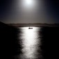 Fishing boat in moonlight